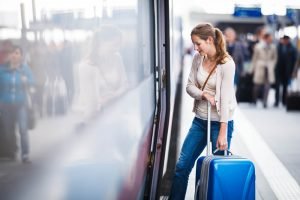 Pretty young woman at a train station
